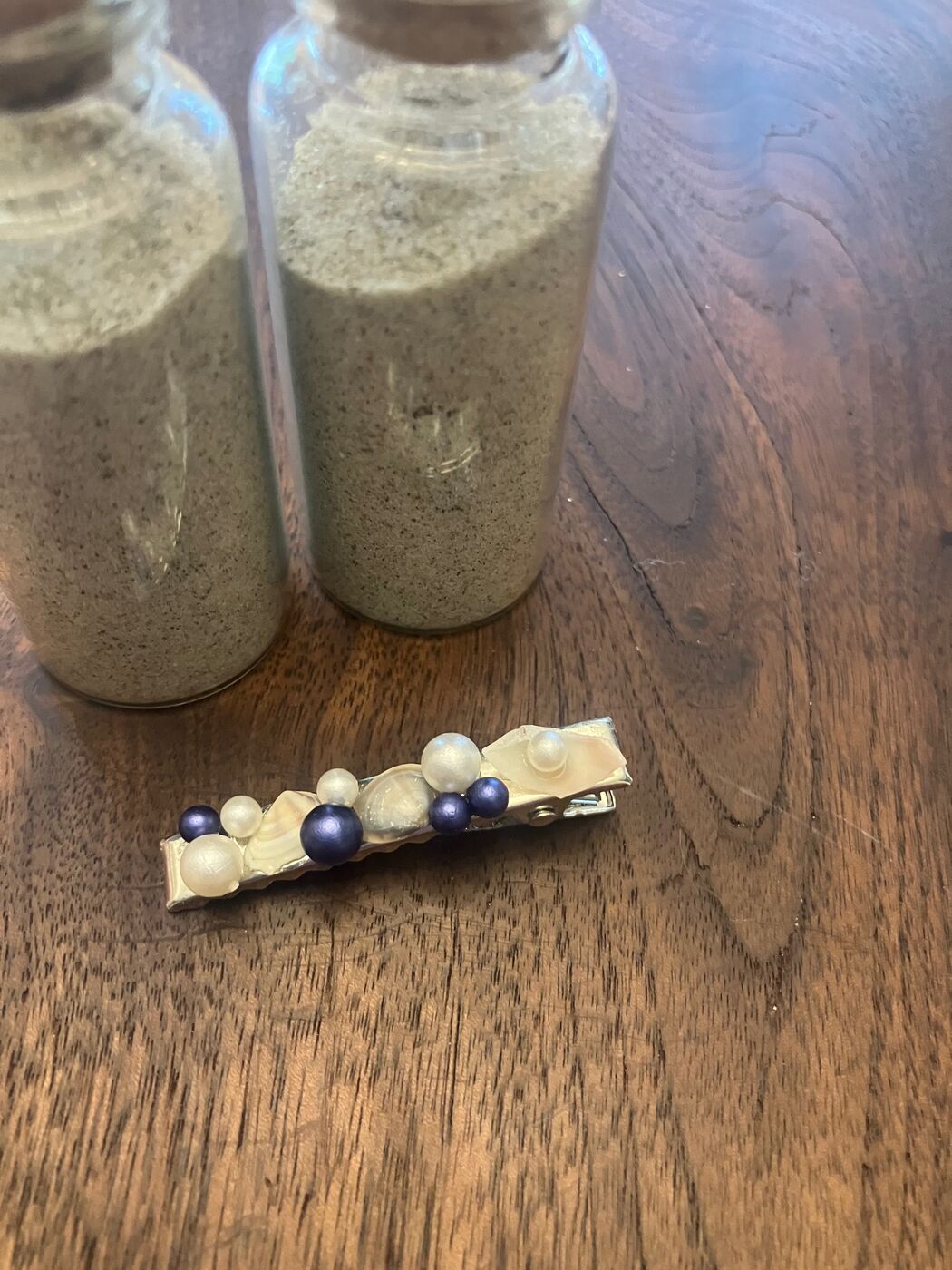 A row of beads along a hair barrette