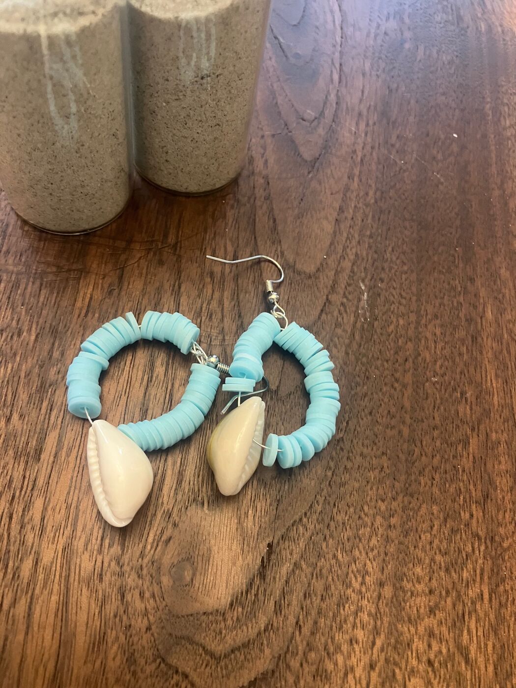 Turquoise beaded hoop earrings with cowrie shells